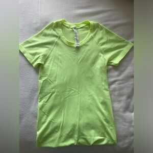 Neon green, size 2, full length, lululemon “Swiftly tech” t-shirt.